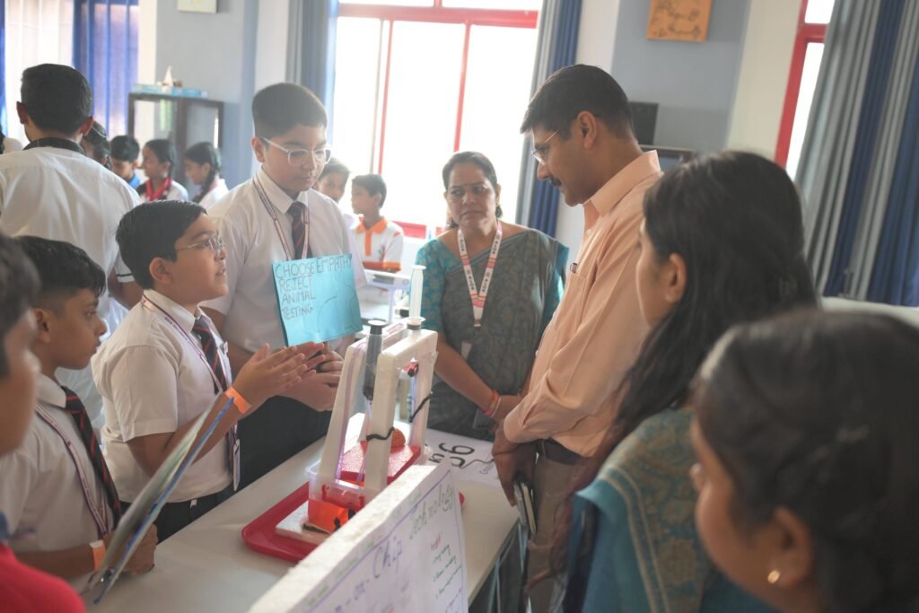 Students in a Chennai school STEM lab present their science project to judges.