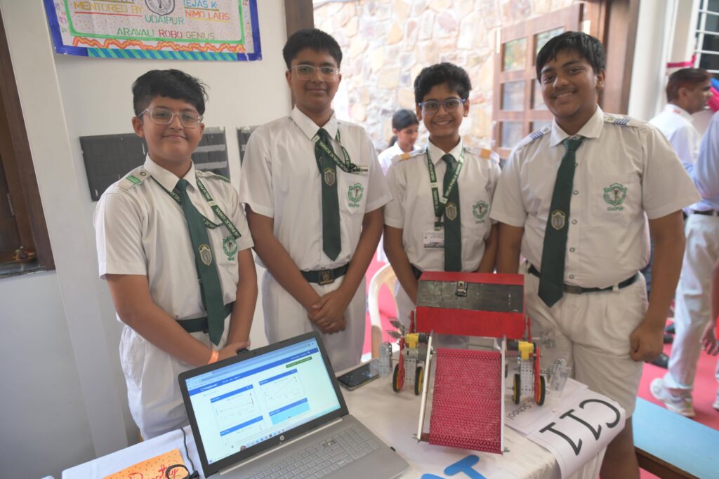 Students showcasing their robotics project in a STEM lab in West Bengal.