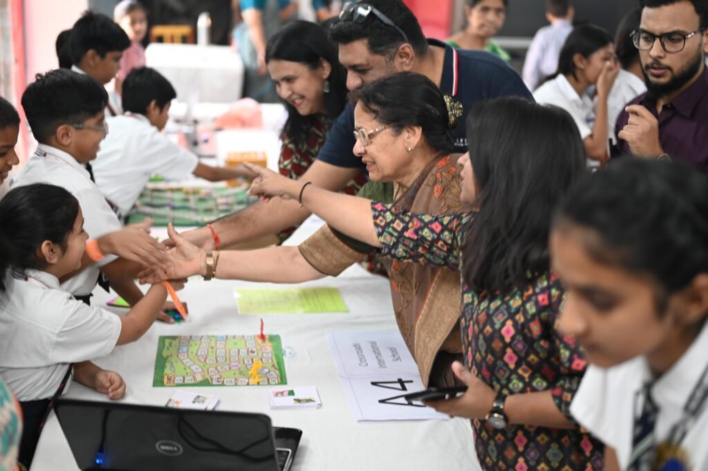 Students interacting with visitors at a STEM lab exhibition in Vishakhapatnam