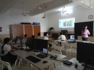 Teacher guiding students during a computer-based session in a STEM lab in Chhattisgarh schools.