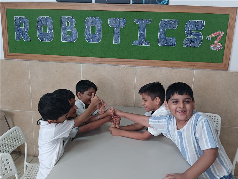 Children enjoying a robotics activity session in a STEM Lab in Vadodara schools, developing teamwork and problem-solving skills.