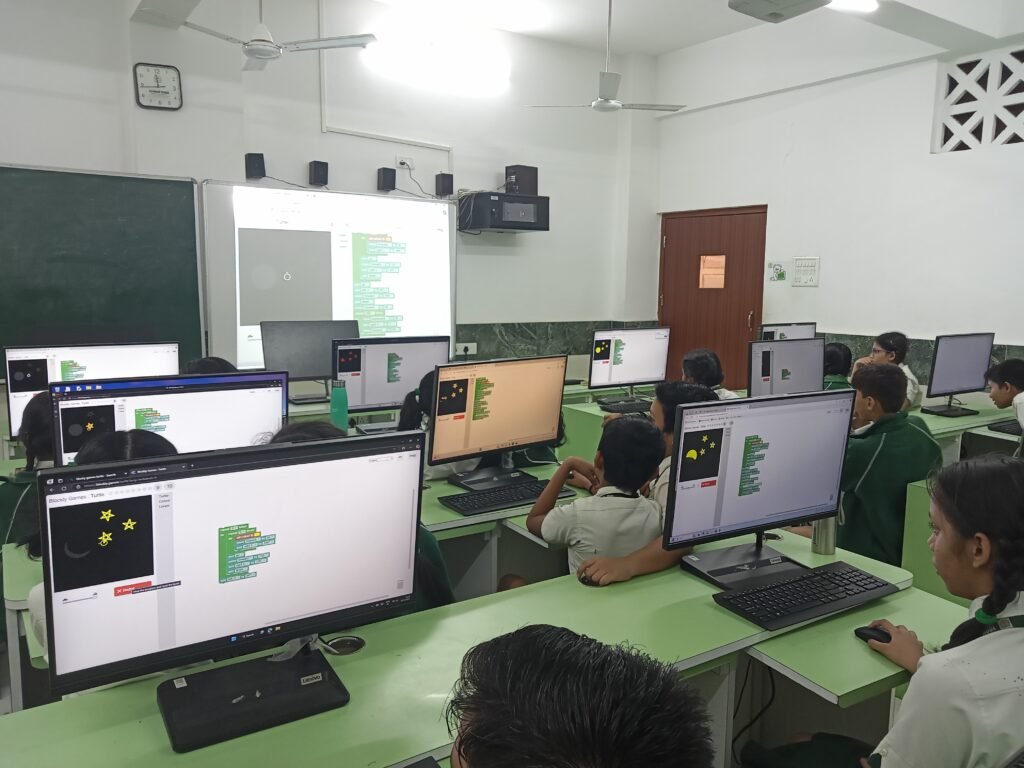Students programming using block-based tools in a STEM Lab in Delhi Schools.