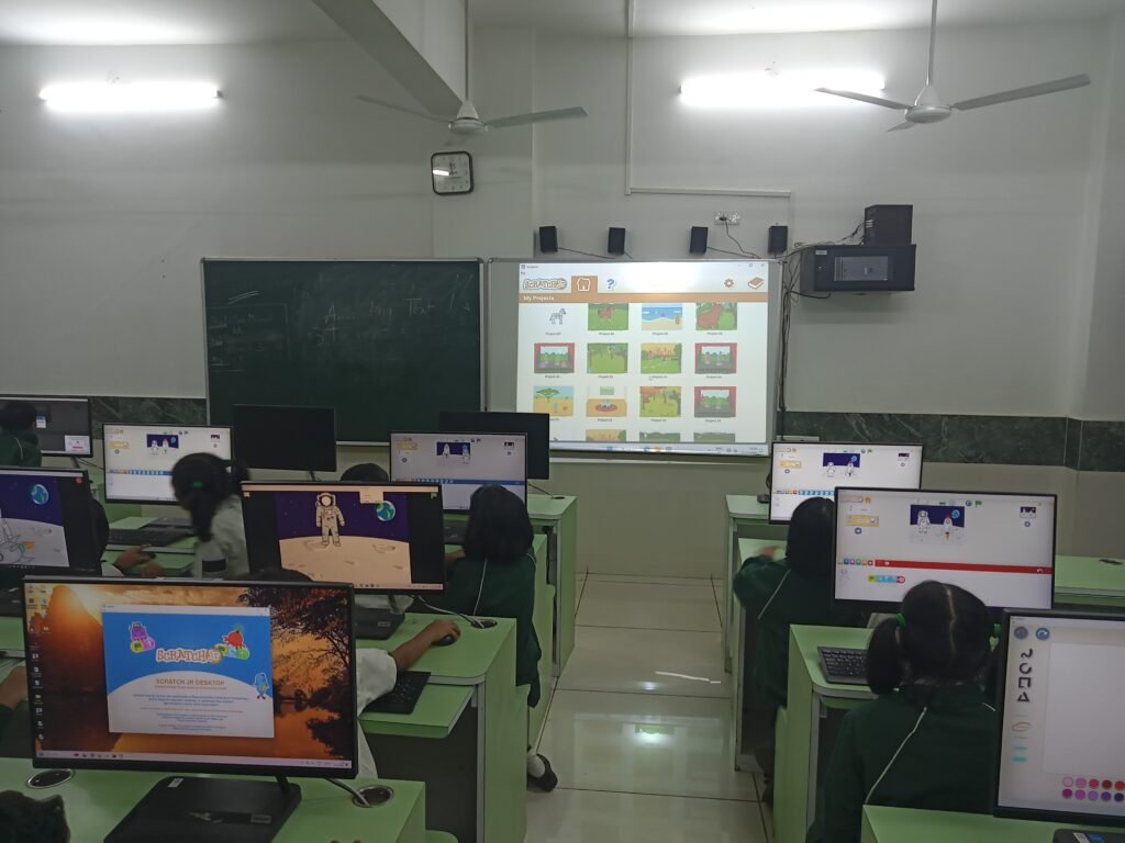 Students working on Scratch programming in a modern STEM Lab in Delhi Schools.