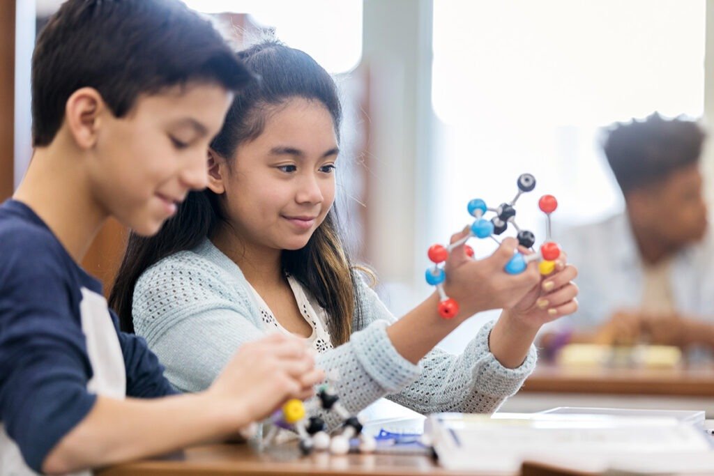 Two students build molecular models during a session in a stem lab in Chhattisgarh schools.