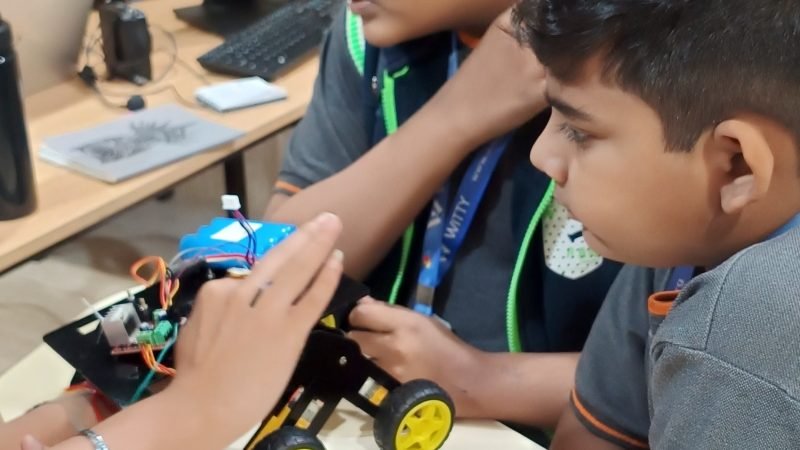 Students assembling robot