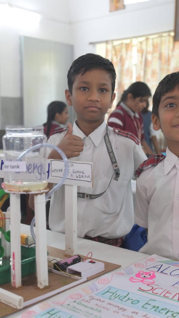 Children demonstrating a hydro energy model at a school science exhibition