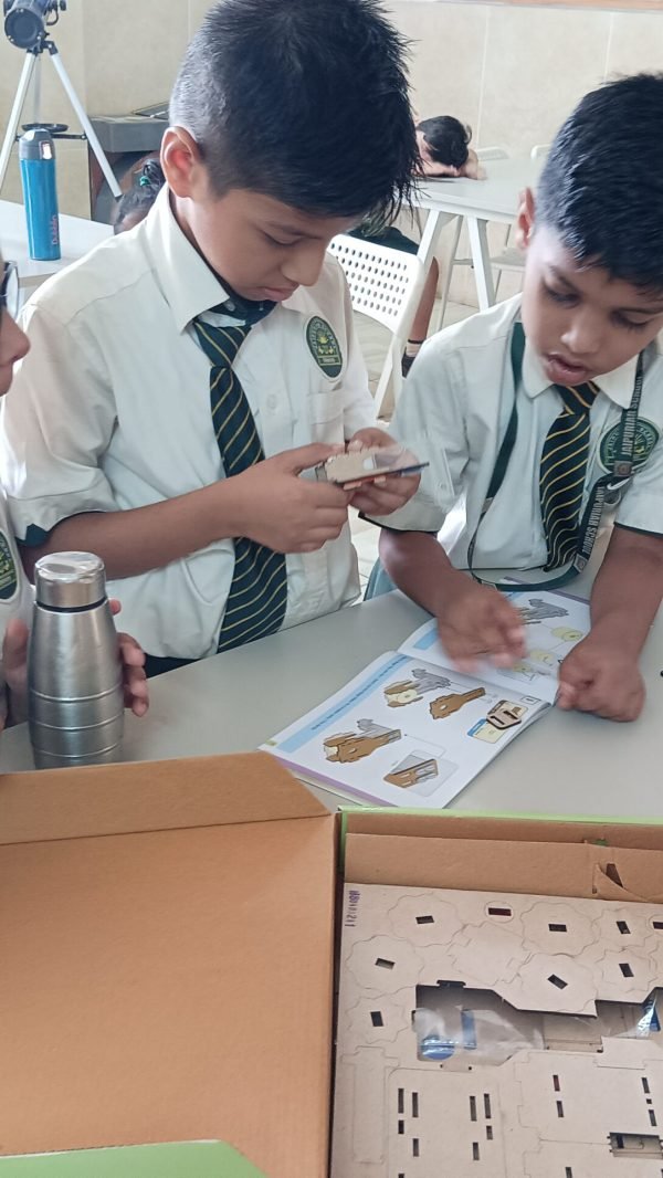 Children collaborating on a science kit activity in a stem lab in Vadodara schools.