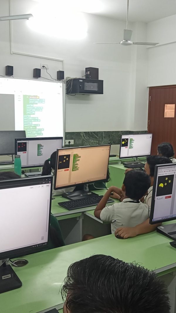 Students programming using block-based tools in a STEM Lab in Delhi Schools.
