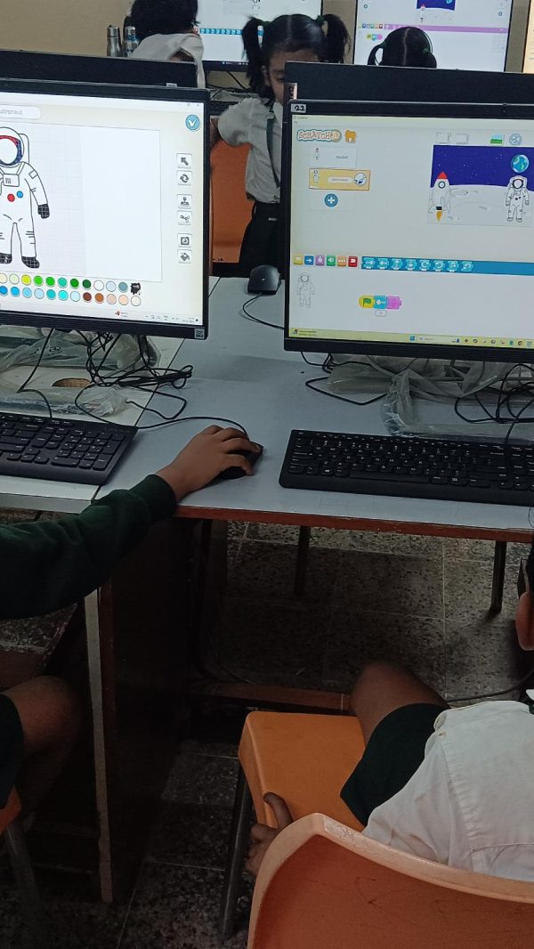 Children using educational software in a STEM lab in Chhattisgarh schools.